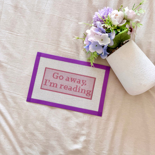 Go away, I'm reading! pink needlepoint canvas